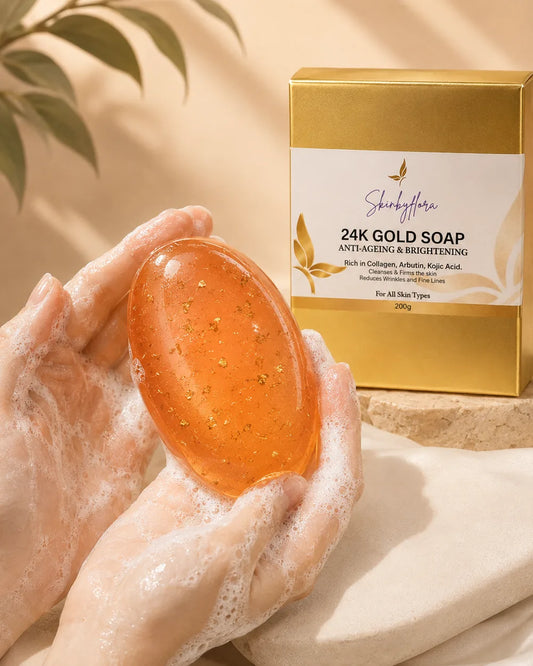Skin by Flora 24K Gold Soap oval pinky-orange bar with gold particles in lathered hands