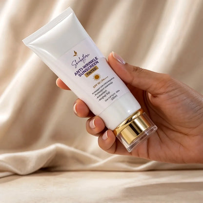 Skin by Flora Anti-Wrinkle Tinted Sunscreen SPF 90 held in hand