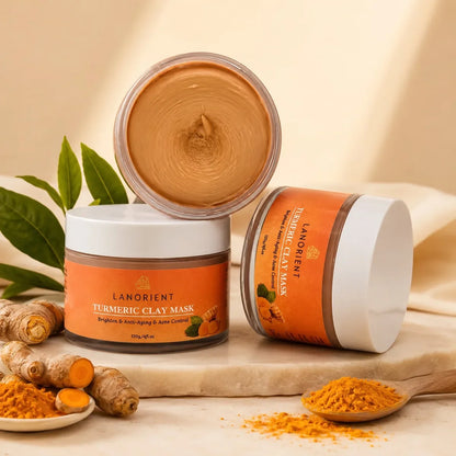 Open Turmeric Clay Face Mask jars on a cream studio background